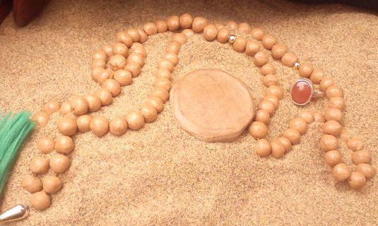 گذاشتن تسبیح در قبر